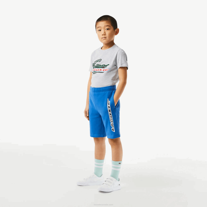 Boys Lacoste V0ZN3087 Blue KXB Organic Cotton Contrast Branding Shorts - Image 1
