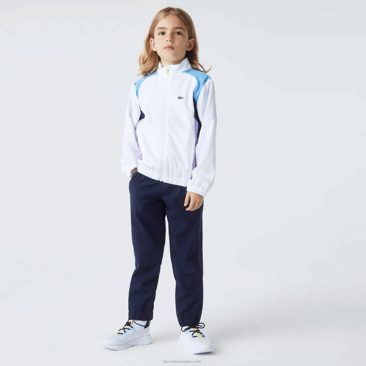 kids_lacoste_v0zn3185_white_navy_blue_purple_6hu_sport_color_block_tennis_tracksuit.png Kids Lacoste V0ZN3185 White Navy Blue Purple 6HU SPORT Color-Block Tennis Tracksuit - Image 1