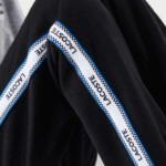 Kids Lacoste V0ZN3223 Black Blue 985 Printed Bands Trackpants - Image 6