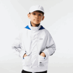 Kids Lacoste V0ZN3240 White Blue Black 9CW Removable Hood Water-Repellent Jacket - Image 2