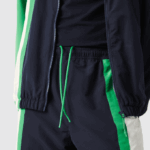 Men Lacoste V0ZN1180 Navy Blue White Green 19V Lightweight Water-Repellent Color-Block Trackpants - Image 7