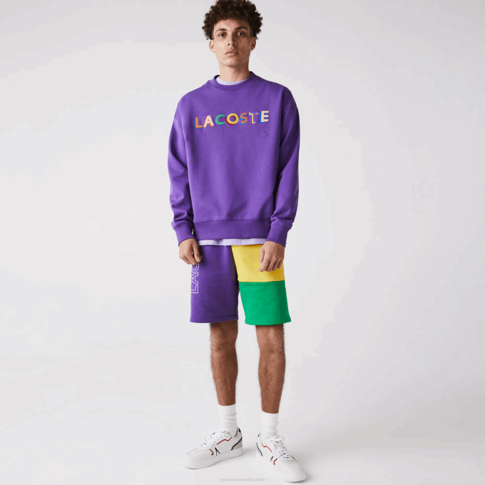 Men Lacoste V0ZN1560 Purple Yellow Green 1CV Lettered Colorblock Fleece Bermuda Shorts - Image 1